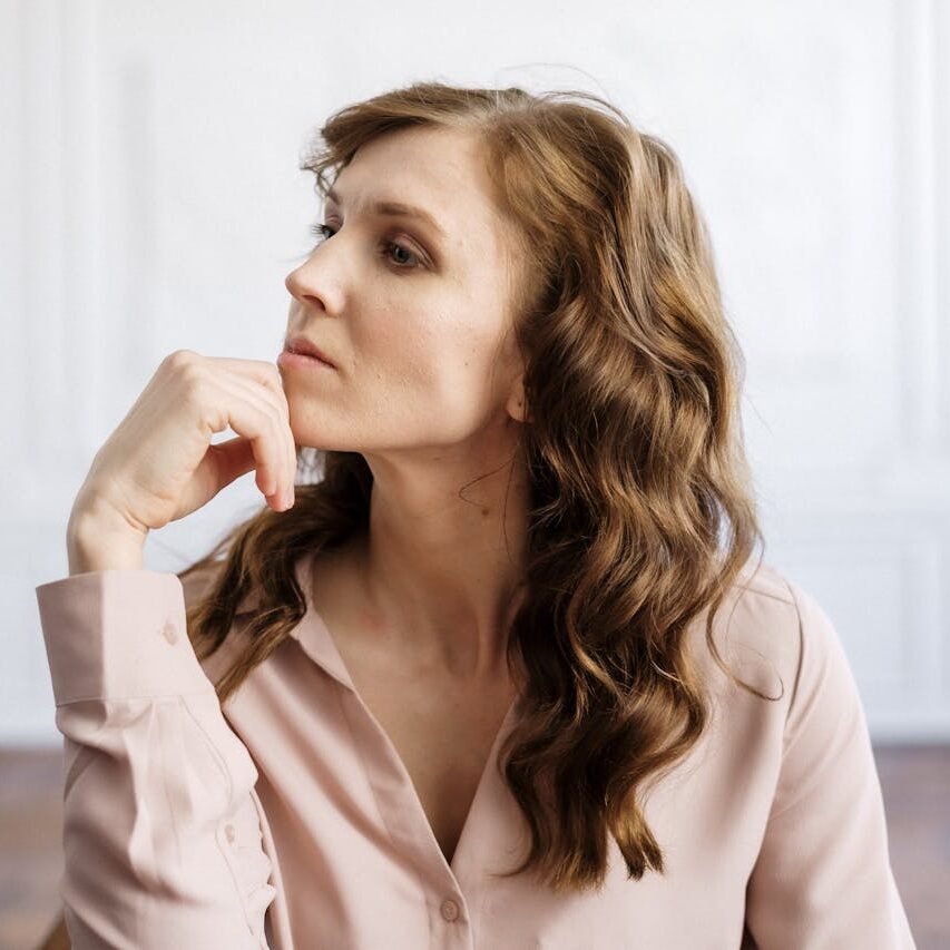 Woman in White Button Up Shirt